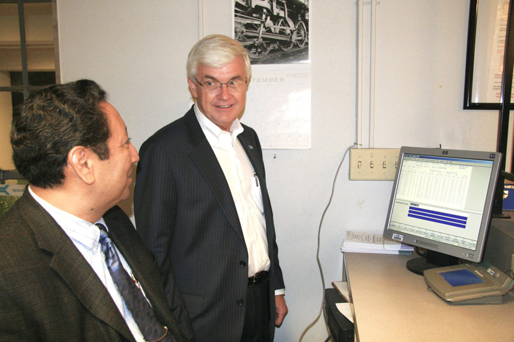 Two men looking at computer screen
