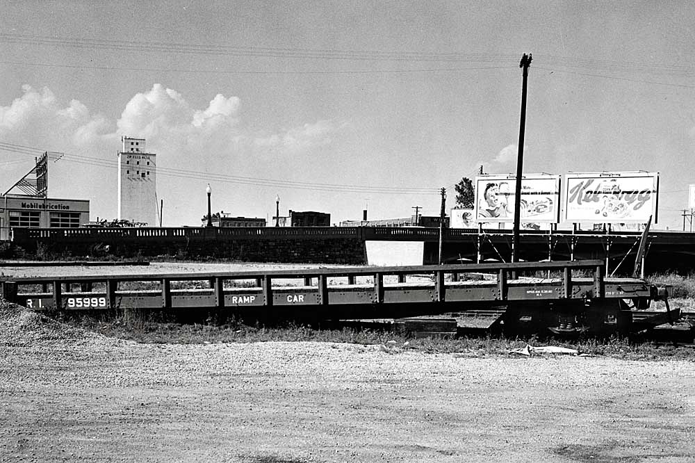 Flatcar converted into ramp for loading flatcars