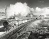 Steam locomotive with freight train.