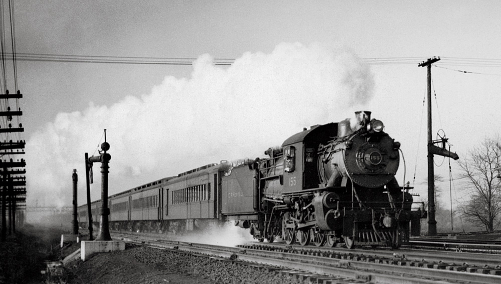 Steam locomotive with passenger train