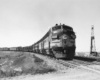 Streamlined diesel locomotives on freight train.