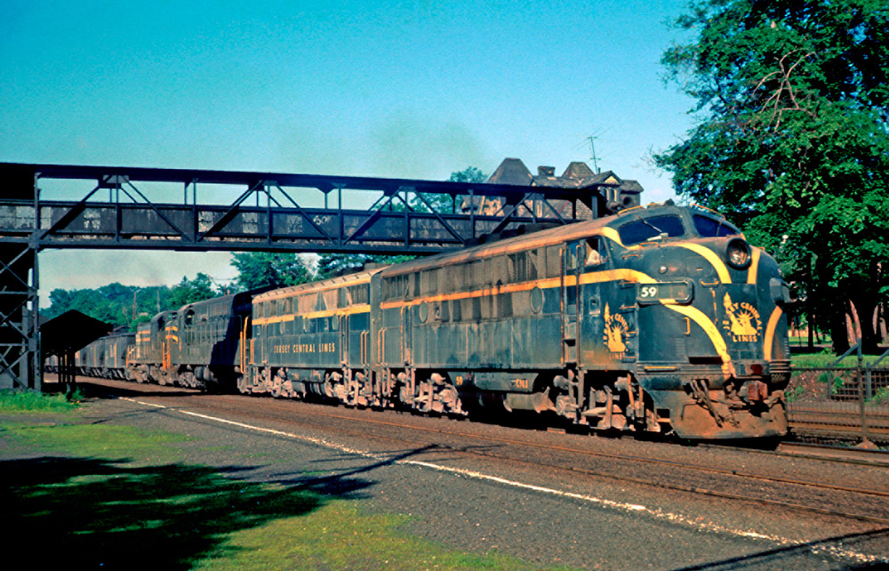 Streamlined and road-switcher diesel locomotives with freight train