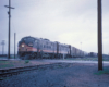 Streamlined diesel locomotives on freight train.