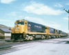 Road-switcher diesel locomotives with freight train.