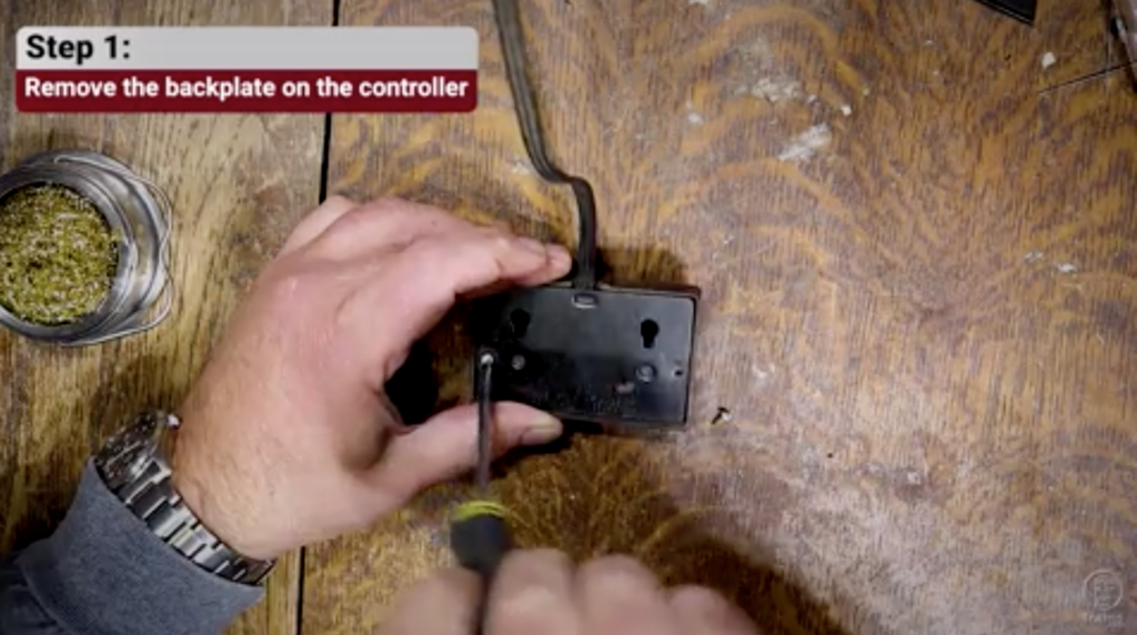 Hands holding a 3-conductor cable