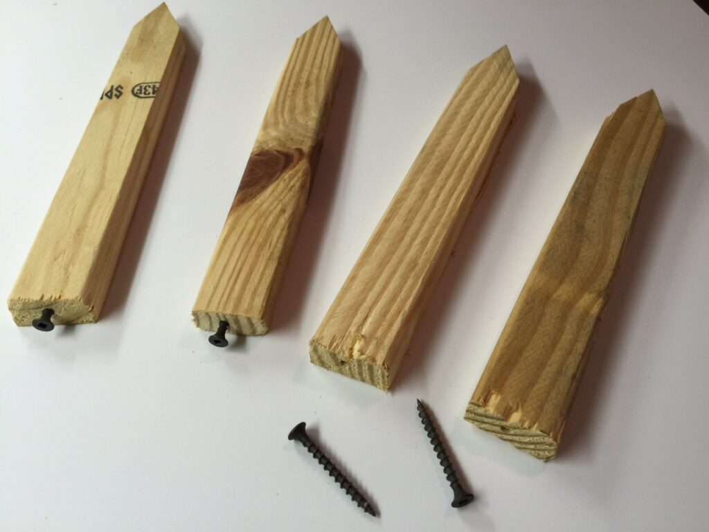 Four handmade stakes made from wood