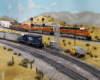 A trio of orange-and-green BNSF diesels leads a mixed freight on the high line while a blue locomotive shoves on the rear of a coal train below