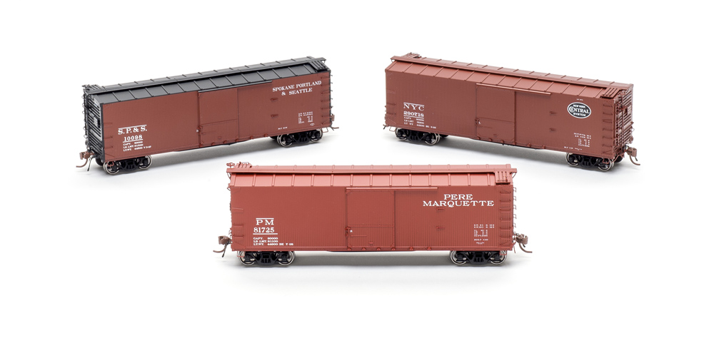 Three Rapido USRA double-sheathed 40-foot boxcars, clockwise from top left Spokane, Portland & Seattle; New York Central; and Pere Marquette