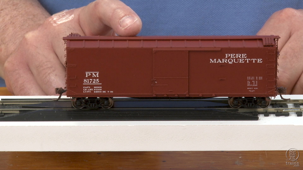 Model boxcar on tracks