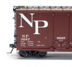 Close-up view of Tangent Scale Models HO scale Northern Pacific Pullman-Standard 40-foot combination-door boxcar.