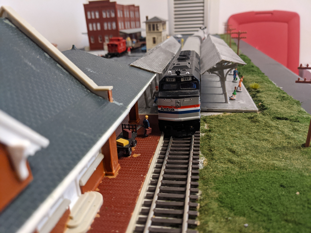 The front of an Amtrak station is shown pulled up to the station platform