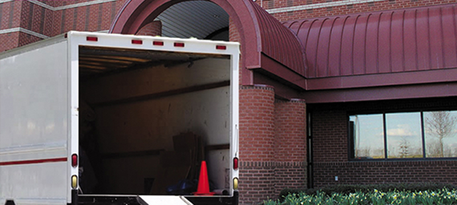 Open garage door with moving truck