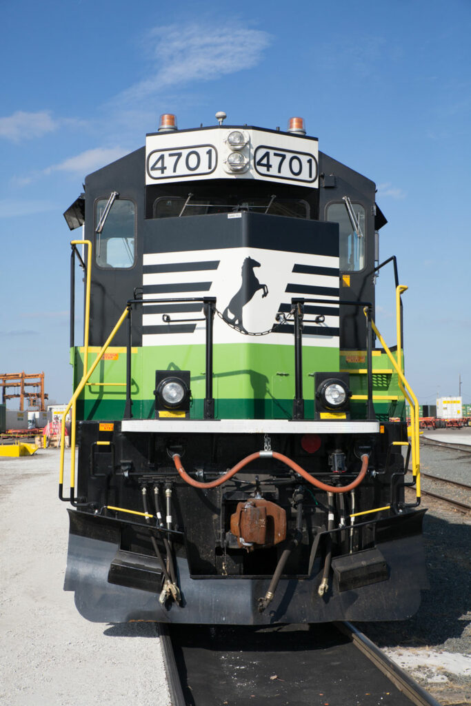 Front view of black and white Norfolk Southern locomotive