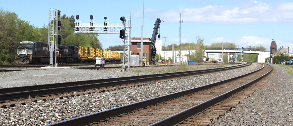 Black locomotives power freight train at junction