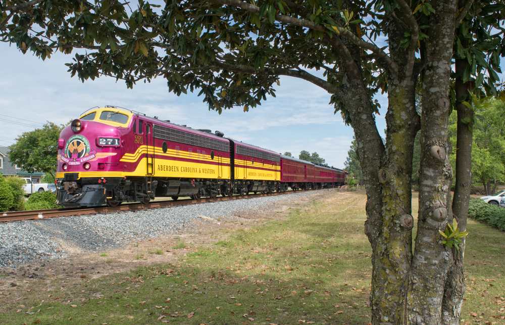 Maroon and yellow F units on passenger train