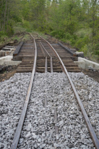 Bridge with realigned track and fresh ballast on approach