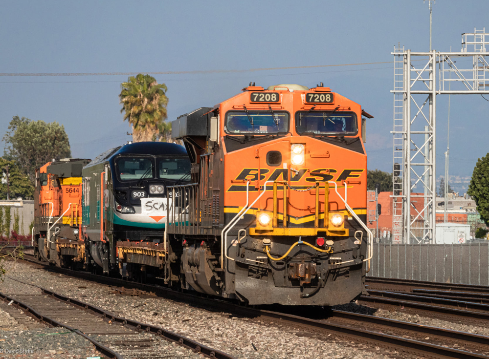 Train with two freight locomotives and one passenger engine