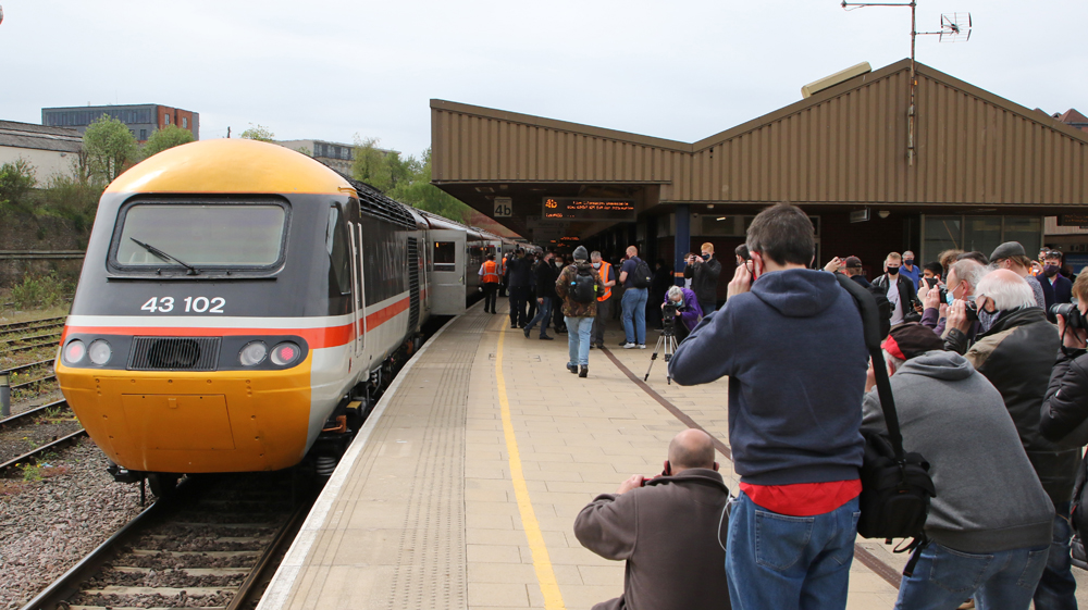 Many people taking pictures of high speed train at station