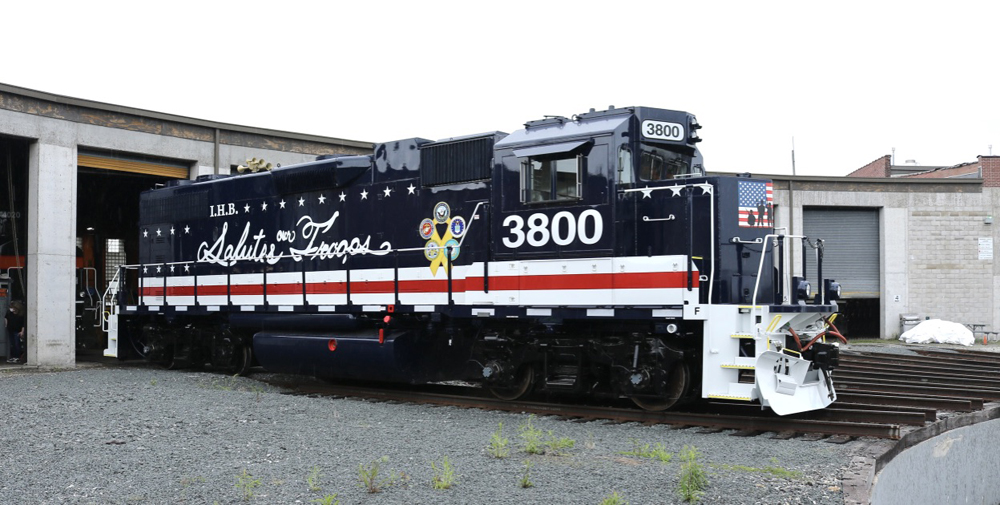 Red, white, and dark blue locomotive