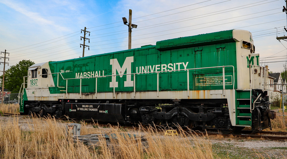 Green and white locomotive with Marshall University lettering