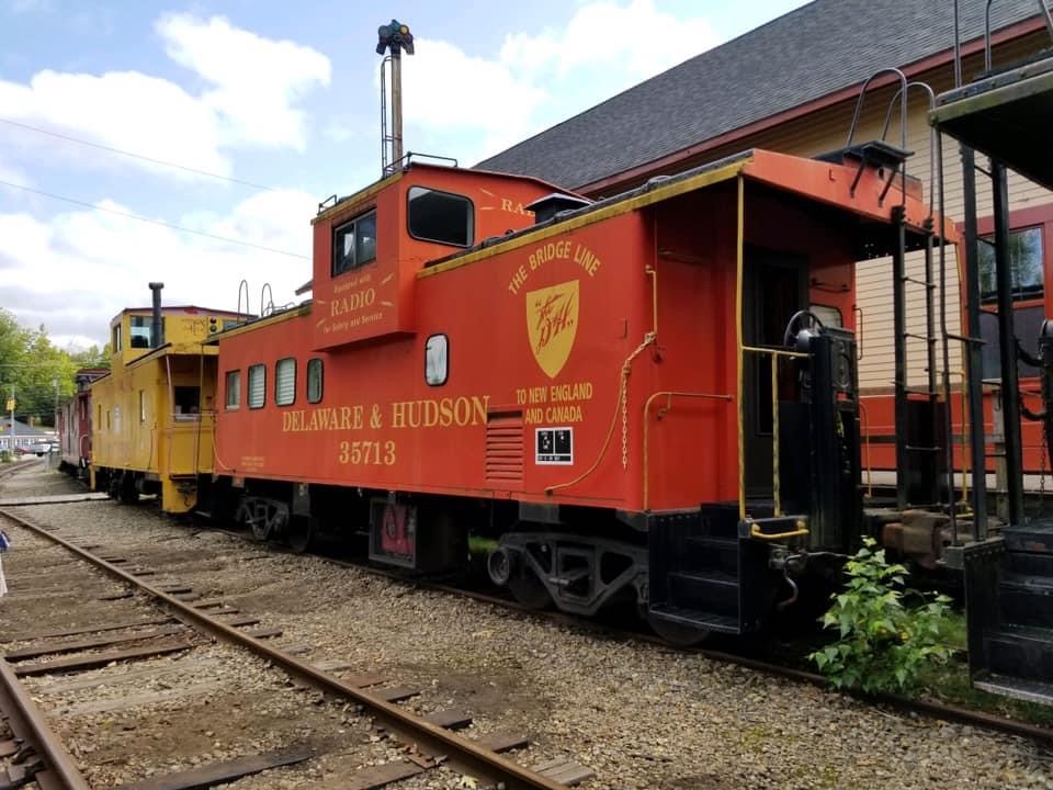 Red caboose with extended-vision cupola