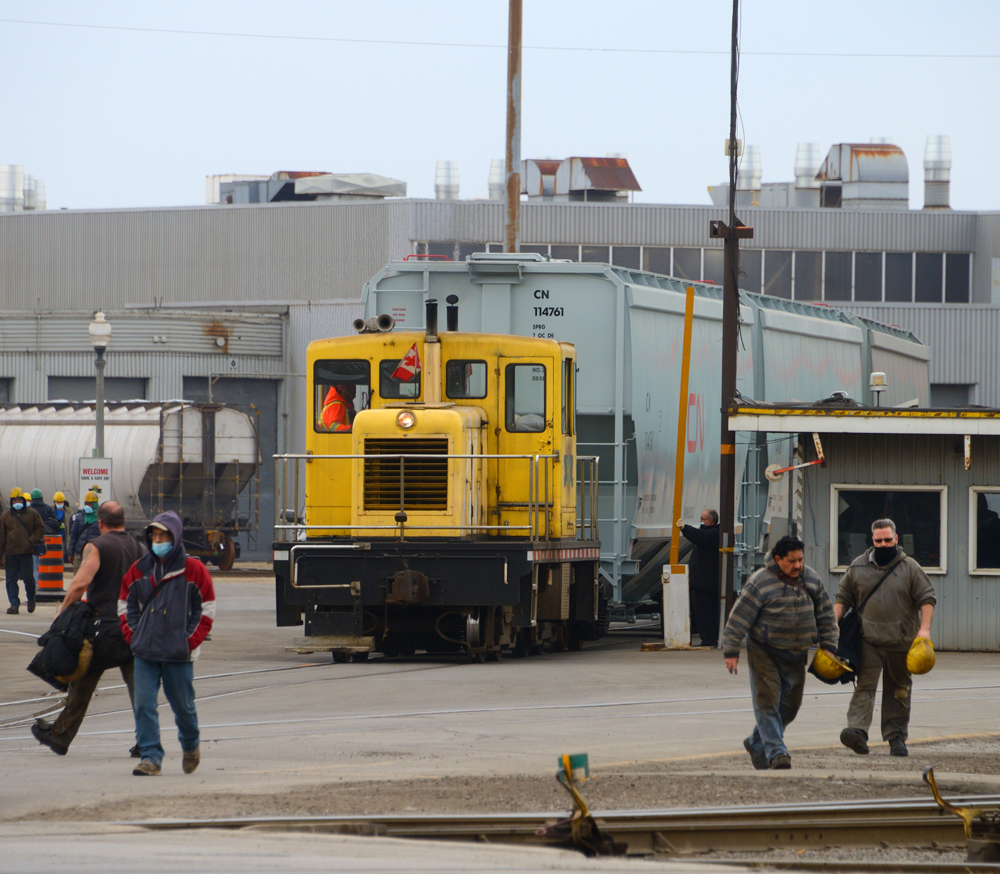 Workers leaving manufacturing plant