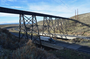 Long railroad bridge over highway