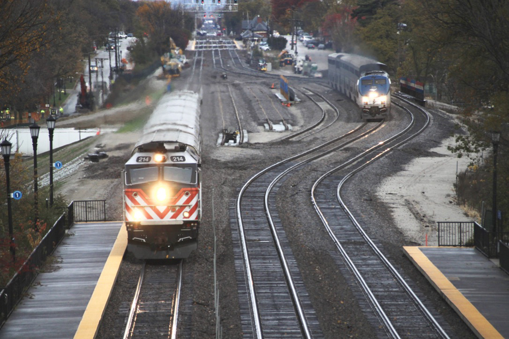 Train traveling straight is now well ahead of passenger train going around curve