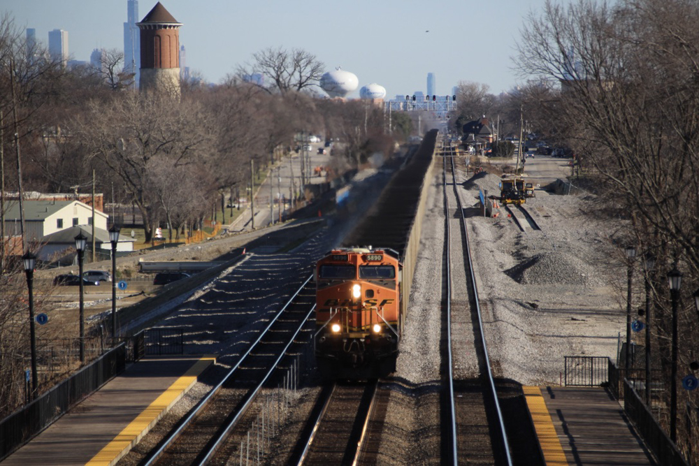 Coal train approaches on straight track