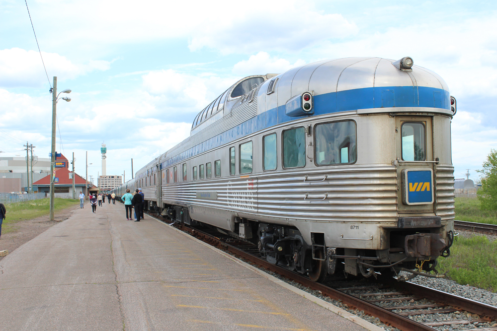 Stainless steal round-end dome-observation car on passenger train