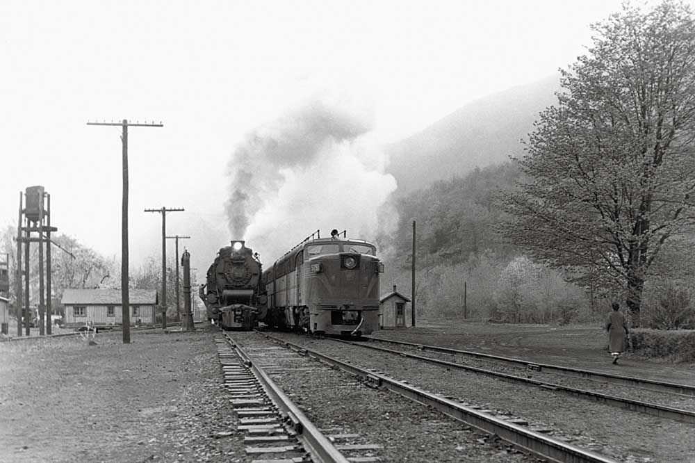 Steam and diesel locomotives park side-by-side