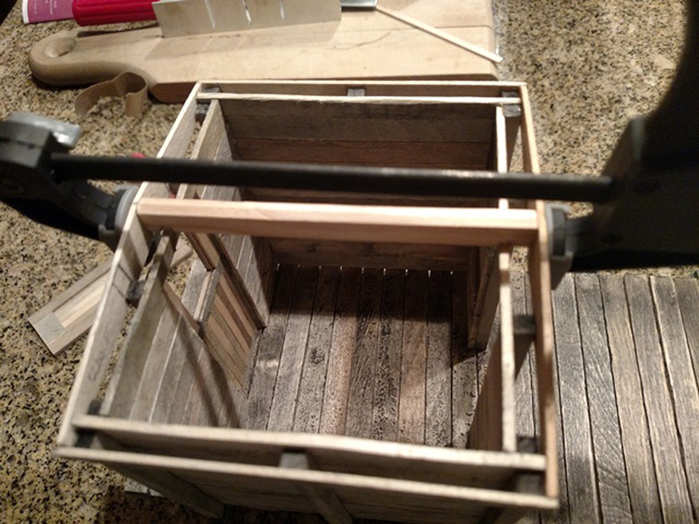 A clamp holds a project while the glue dries.