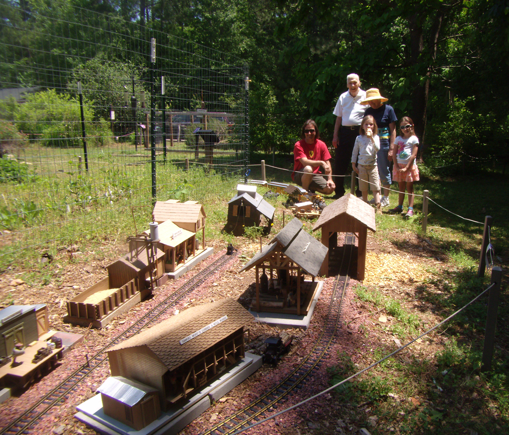 A family watches a large-scale train display
