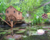 A model mill with water wheel near a small pond.