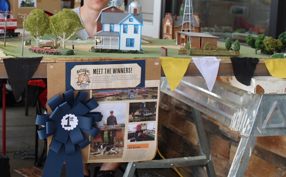 A sign in front of their layout declaring them the winners.