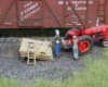 Model figures next to grain elevator