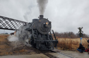 Steam locomotive under bridge in Wisconsin