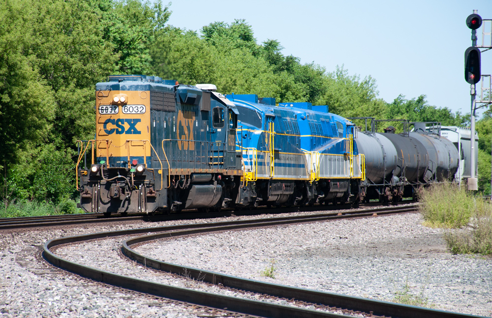Dark blue locomotive leads two BL2 locomotives