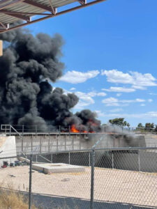 Smoke and flames on railroad bridge