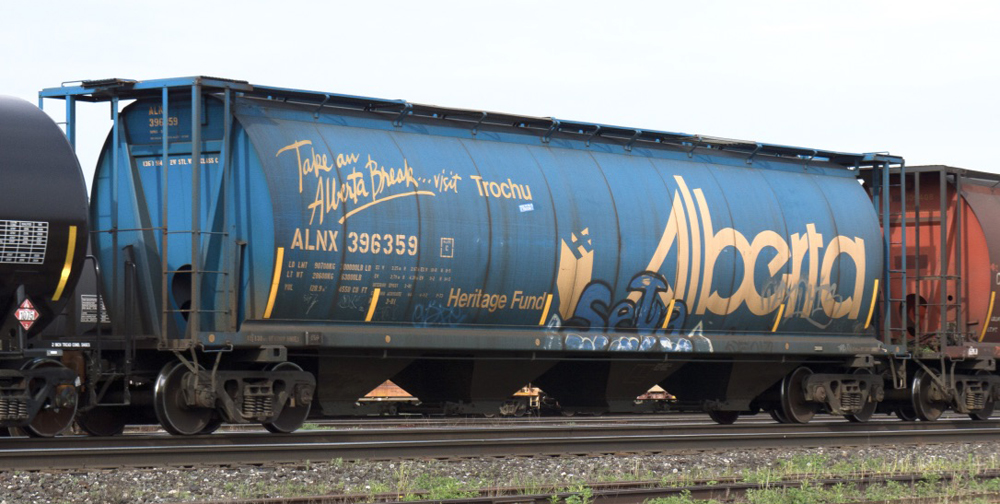 Blue cylindrical hopper car