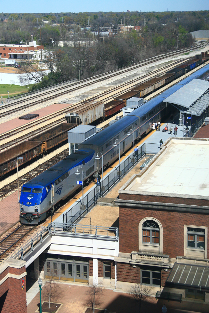 Train visible on track below as viewed from hotel room window