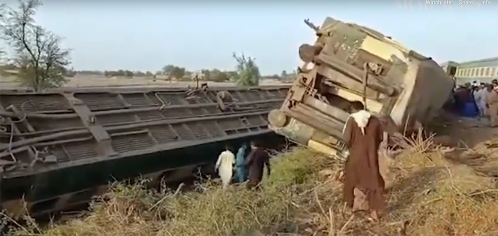 Overturned, damaged passenger cars