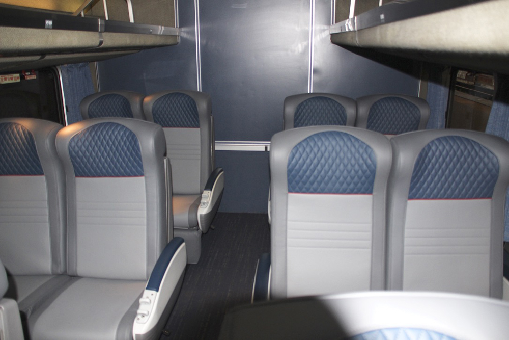 Blue, gray, and white seats in passenger car