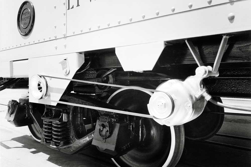 Freight car generator attachment