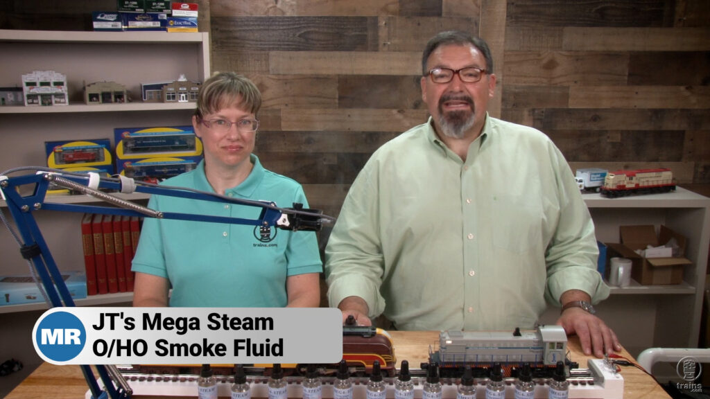Rene Schweitzer and Hal Miller with smoking O gauge steam and diesel lovomotives