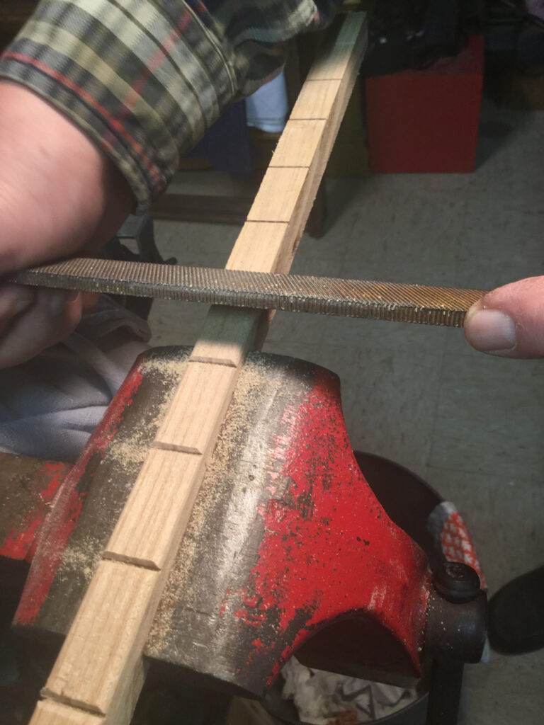 Metal file sanding wood blocks