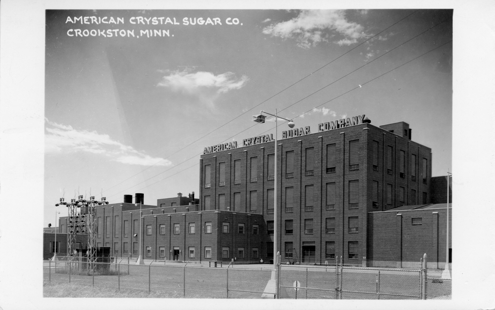 Black-and-white real photo postcard of American Crystal Sugar Co. factory in Crookston, Minn.