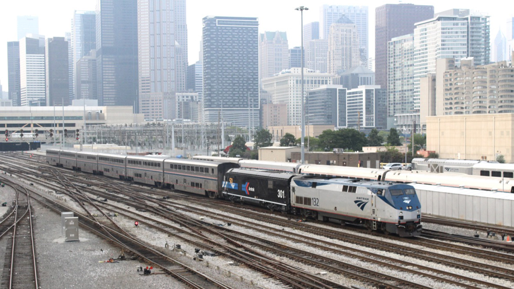 Train with two Amtrak locomotives, second in special black paint scheme