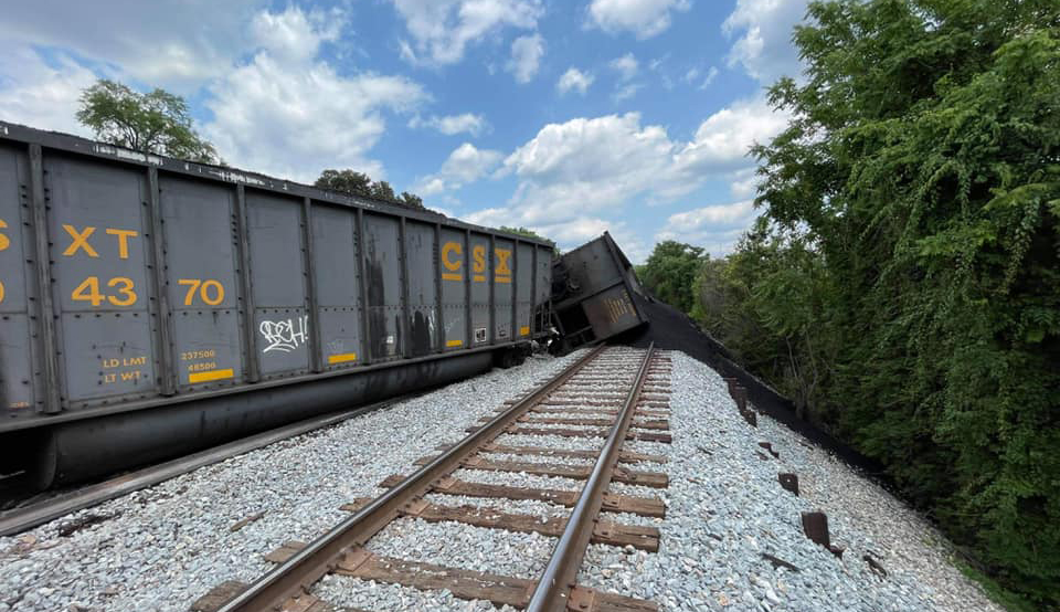 Derailed coal hoppers, some on their side