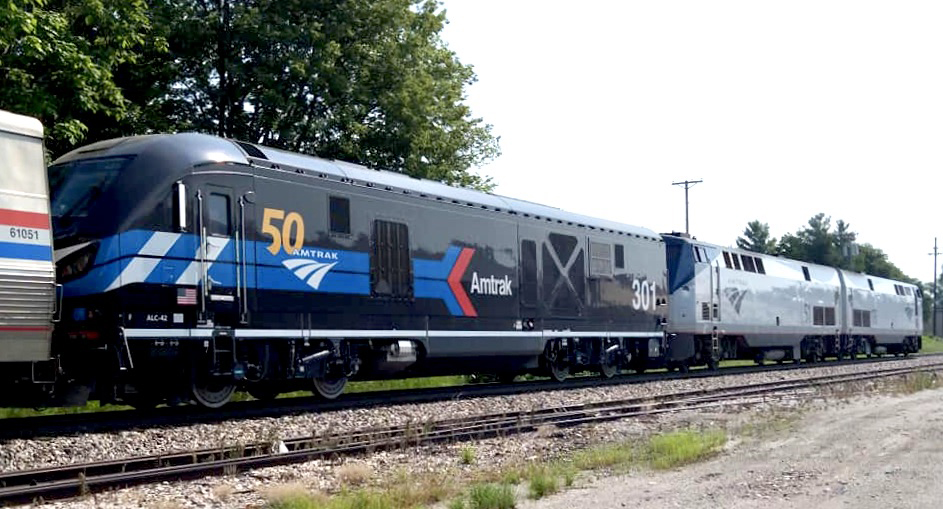 Black locomotive with red and blue arrow